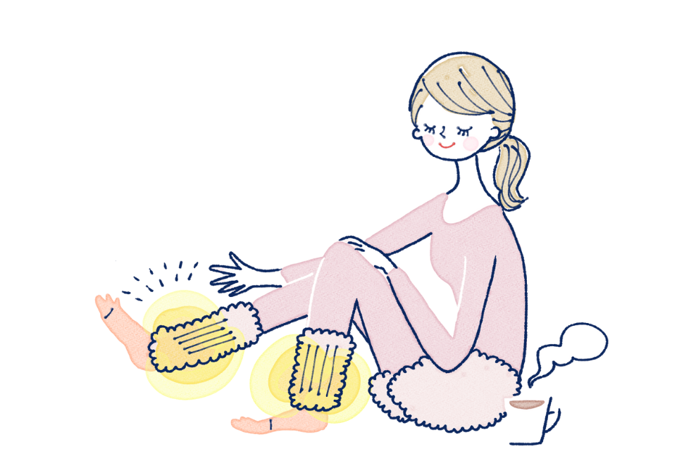 足を温める女性